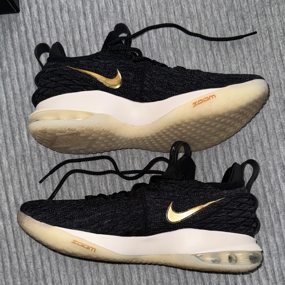 Nike LeBron 15 Low in the Black/Metallic Gold/Phantom colorway. - Picture 4 of 5